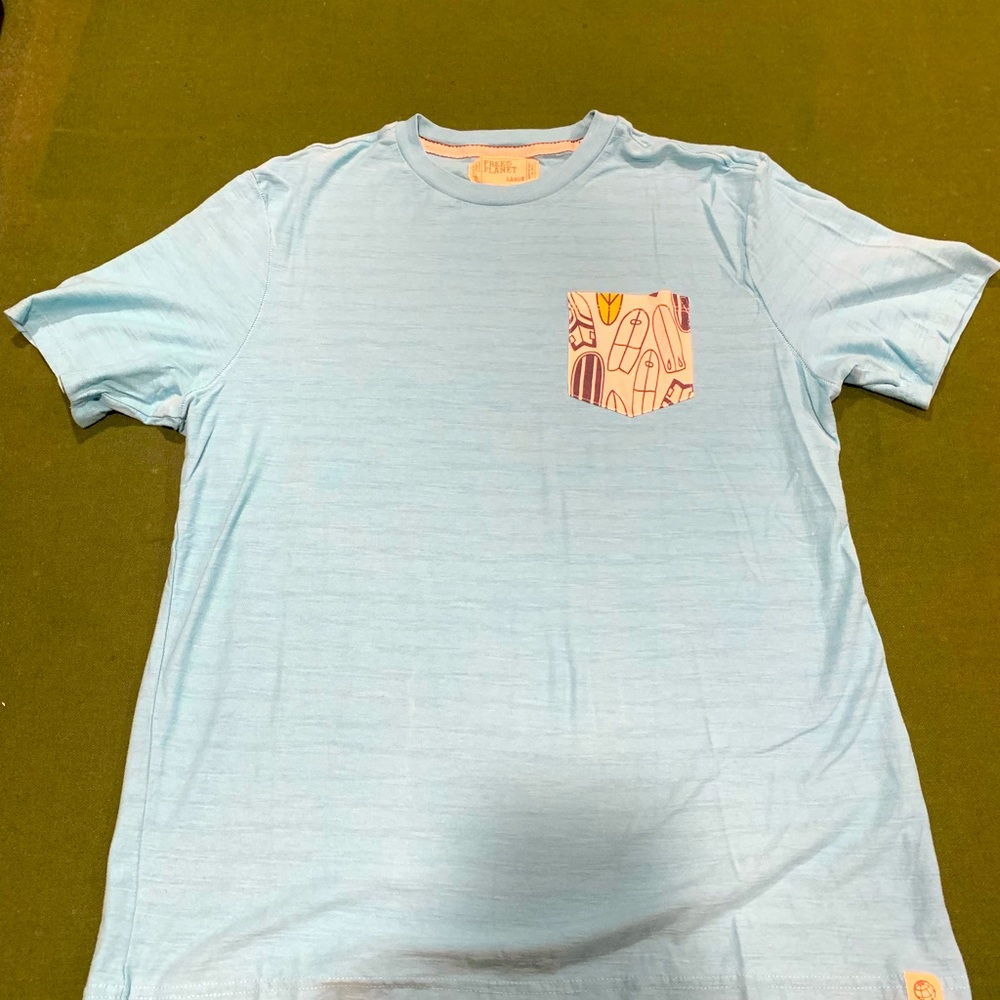 Free Planet Light blue shirt pocket Tshirt